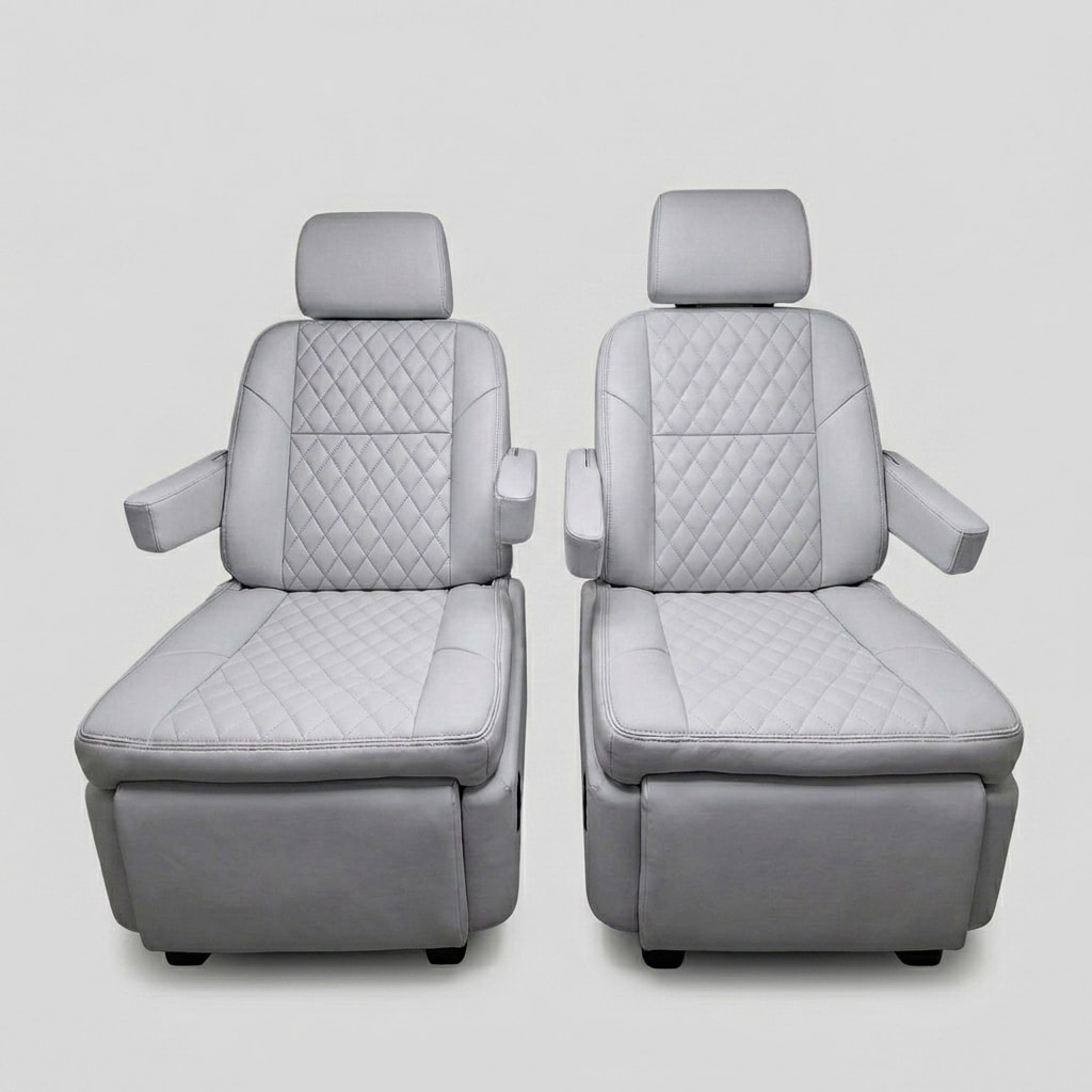 Premium light gray quilted leather captain's chairs reclined with footrests extended, showing electric reclining and footrest adjustment